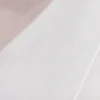 Capa asimétrica de manga larga transparente Ida – Blanca Capa asimétrica de manga larga transparente Ida – Blanca