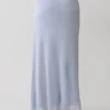 Falda larga con nudo de lurex Adrienne – Azul pastel Falda larga con nudo de lurex Adrienne – Azul pastel