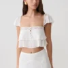 Top corto sin mangas de encaje Skylar – Blanco Top corto sin mangas de encaje Skylar – Blanco