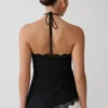 Top halter asimétrico de encaje Theodosia – Negro Top halter asimétrico de encaje Theodosia – Negro