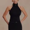 Falda Emilia con cinturilla de pedrería – Negro Falda Emilia con cinturilla de pedrería – Negro