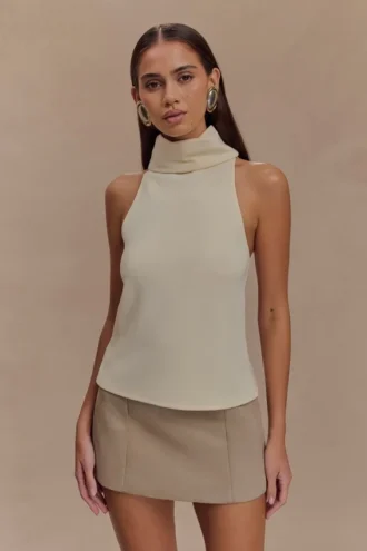Top sin mangas de cuello alto Birdie – Marfil