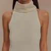 Top sin mangas de cuello alto Birdie – Marfil Top sin mangas de cuello alto Birdie – Marfil