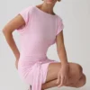 Vestido mini Maiara de manga corta con lazo y corte ceñido – Rosa Vestido mini Maiara de manga corta con lazo y corte ceñido – Rosa