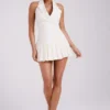Vestido mini plisado Antoinette – Marfil Vestido mini plisado Antoinette – Marfil